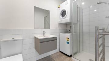 Shower, hair dryer, towels, soap