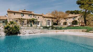 Seasonal outdoor pool, open 8:30 AM to 8:30 PM, pool umbrellas