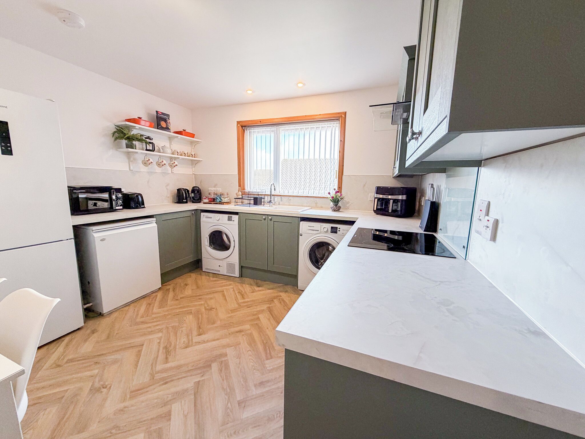 Fridge, stovetop, coffee/tea maker, dining tables