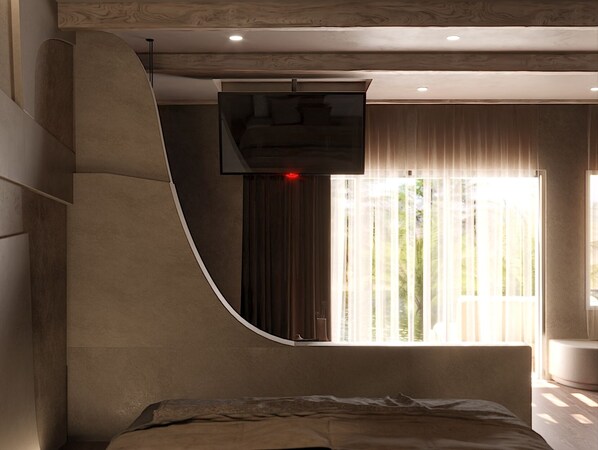Un dormitorio moderno con una pared curva, un ventanal con cortinas translúcidas y un televisor de pantalla plana montado en la pared.