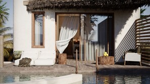 Suite Deluxe, vista parcial al mar | Alberca | Alberca al aire libre por temporada 