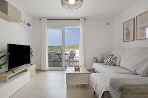TV - Modern Atlanterra Apartment with Shared Pool, Solar Panels, Battery & Backup (Atlanterra)