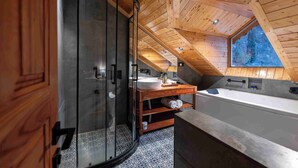A modern bathroom with a glass shower enclosure, wooden ceiling, and a large skylight. - The Villa Himalaya (Srinagar)