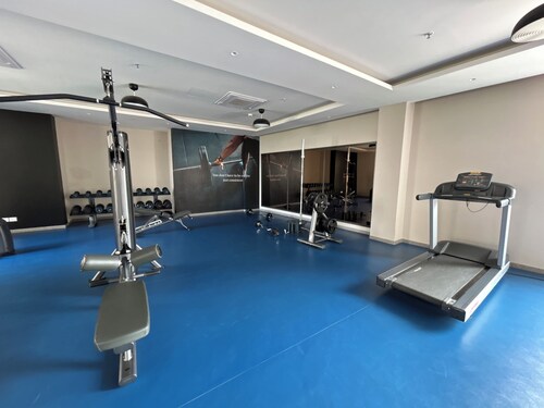 2-bedroom apartment in serene GIFT city with AC, Pool, Gym, Family/Business Stay