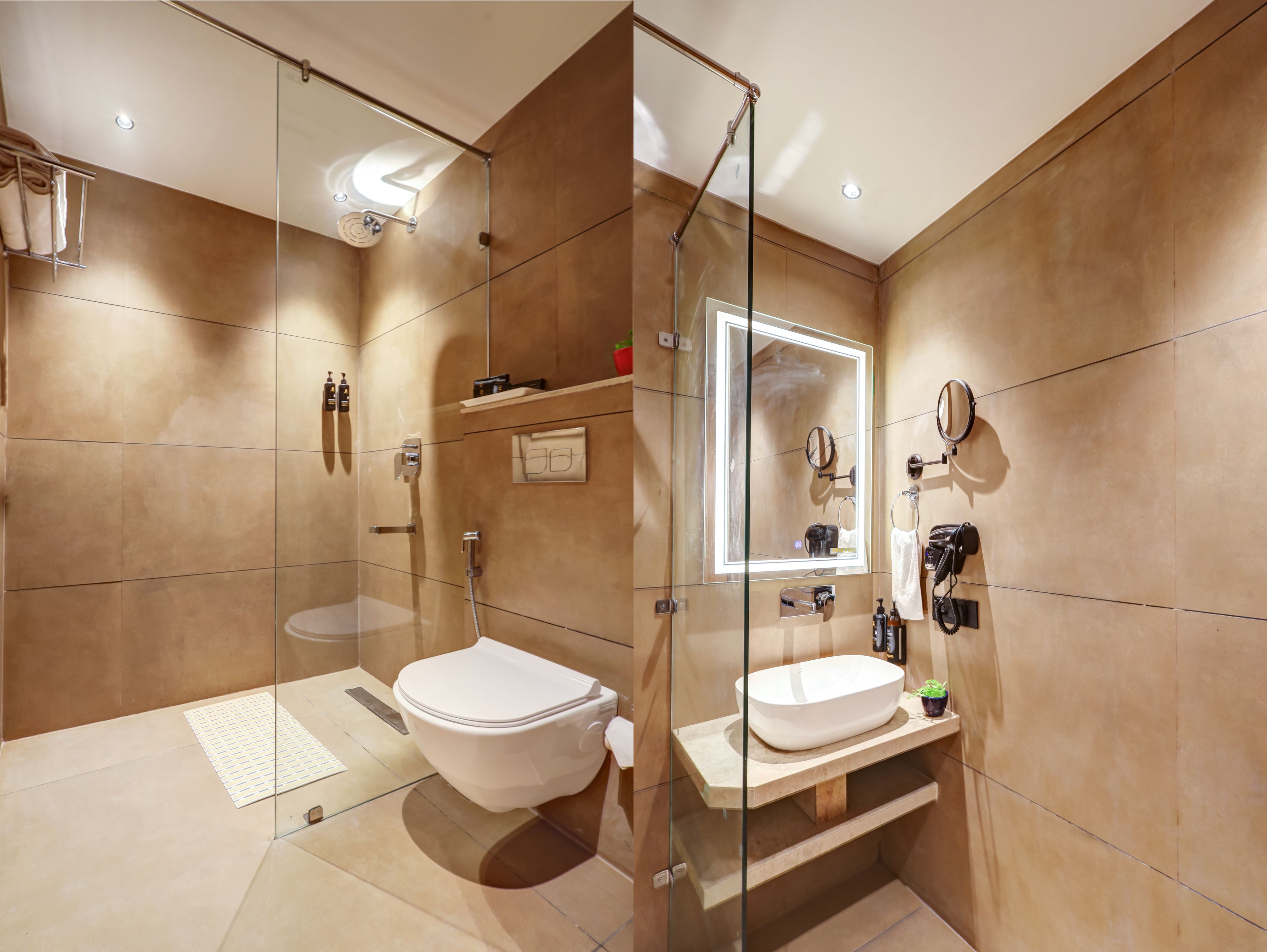 A modern bathroom with a glass-enclosed shower, a white toilet, and a vanity with a mirror.