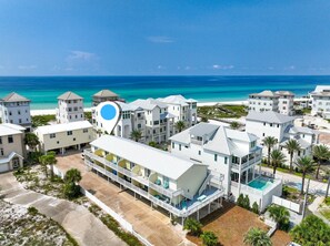 A coastal hotel with multiple buildings, a pool, and a beach view. - Gulf Views! 2 Bedroom Townhome in Inlet Beach! (Inlet Beach)