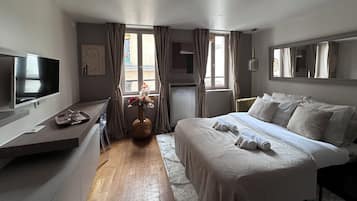 Deluxe Apartment, City View | Living area | 80-cm Smart TV with digital channels