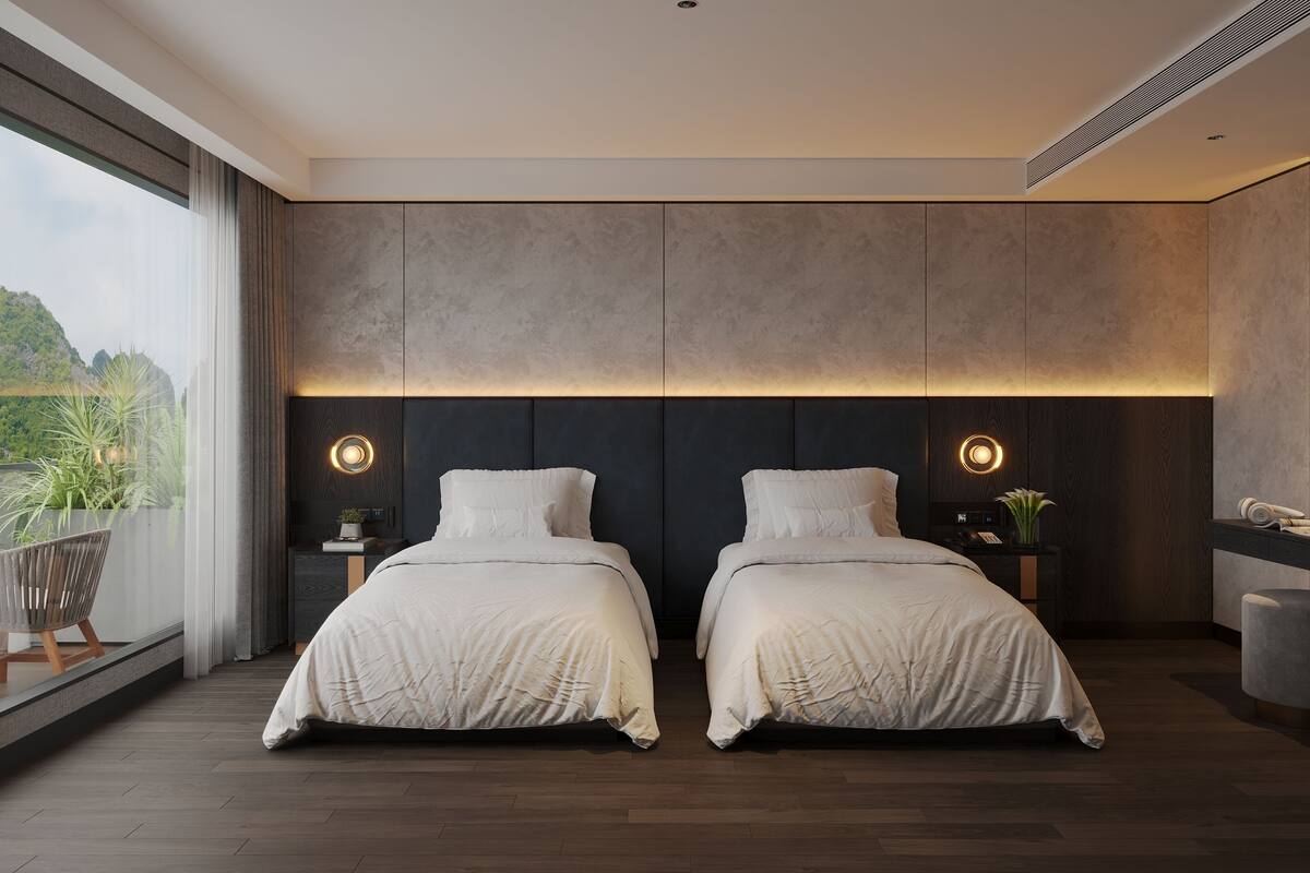 A modern bedroom with two beds, a large window, and a balcony.