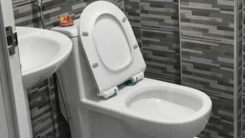 Shower, rainfall showerhead, towels, soap