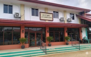 A building with a sign reading "CCMPC ACCOMMODATION". - Comfy Siquijor Rooms formerly CCMPC (San Juan)