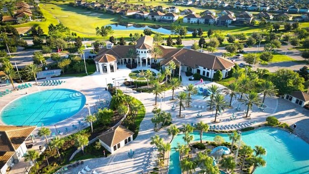 A resort with multiple swimming pools, a golf course, and residential buildings. - Comfortable Beds - Fully Equipped Kitchen Pool Spa (Kissimmee)