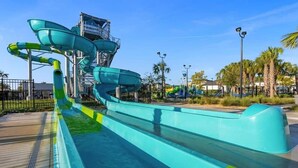A water park with multiple slides and a pool area. - Ultimate Comfort Prime Location Luxury Villa (Kissimmee)