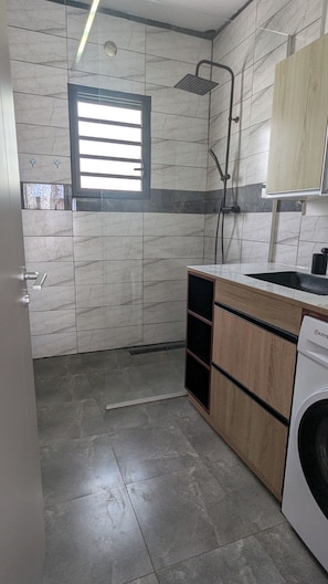 Shower, towels, soap, toilet paper