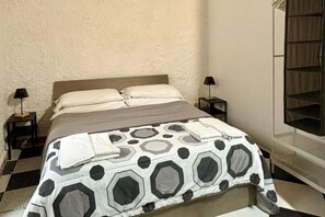 1 bedroom, desk, iron/ironing board, travel crib