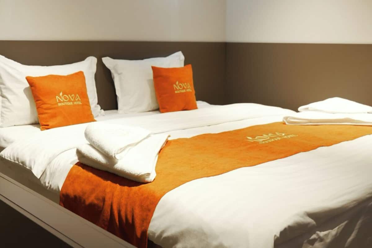 Deluxe Triple Room | Living area | Heated floors