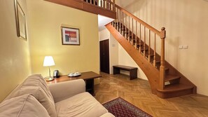 Deluxe Duplex | Living area | 43-inch flat-screen TV with cable channels, printers - Fleur De Lis Hotel  (Prague)