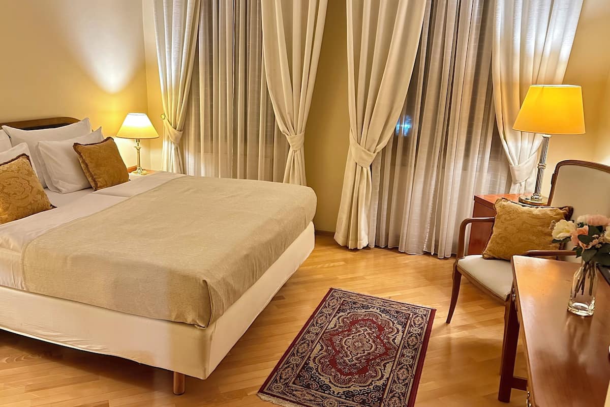 Standard Double Room | In-room safe, desk, laptop workspace, iron/ironing board