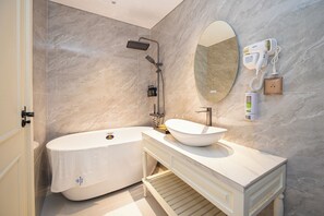 Family Studio Suite, Courtyard View | Bathroom | Free toiletries, hair dryer, slippers, towels - Boss Hotel Phu Quoc (Phu Quoc)
