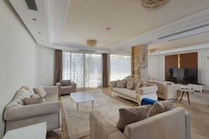 65-inch Smart TV with digital channels - Alsawah 4 En-Suite Villa Private Pool (Sheikh Zayed City)