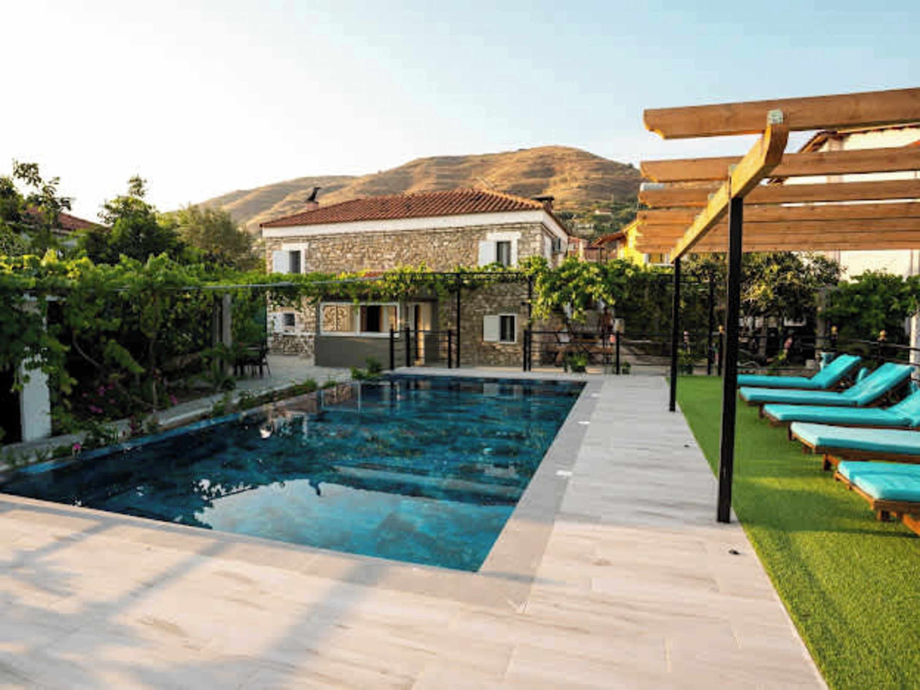 Shared swimming pool surrounded by greenery – perfect for cooling off on sunny days