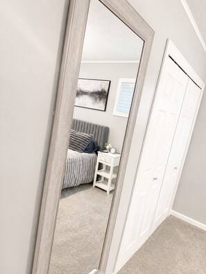 A bedroom with a bed, bedside table, and a wardrobe. - NEW-Pictured Rocks Paradise!
Near Pictured Rocks & Lake Superior! (Shingleton)