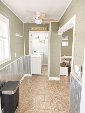 A laundry room with a ceiling fan, a washing machine, and a dryer. - NEW-Pictured Rocks Paradise!
Near Pictured Rocks & Lake Superior! (Shingleton)