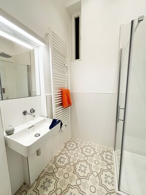 Shower, hair dryer, towels, toilet paper