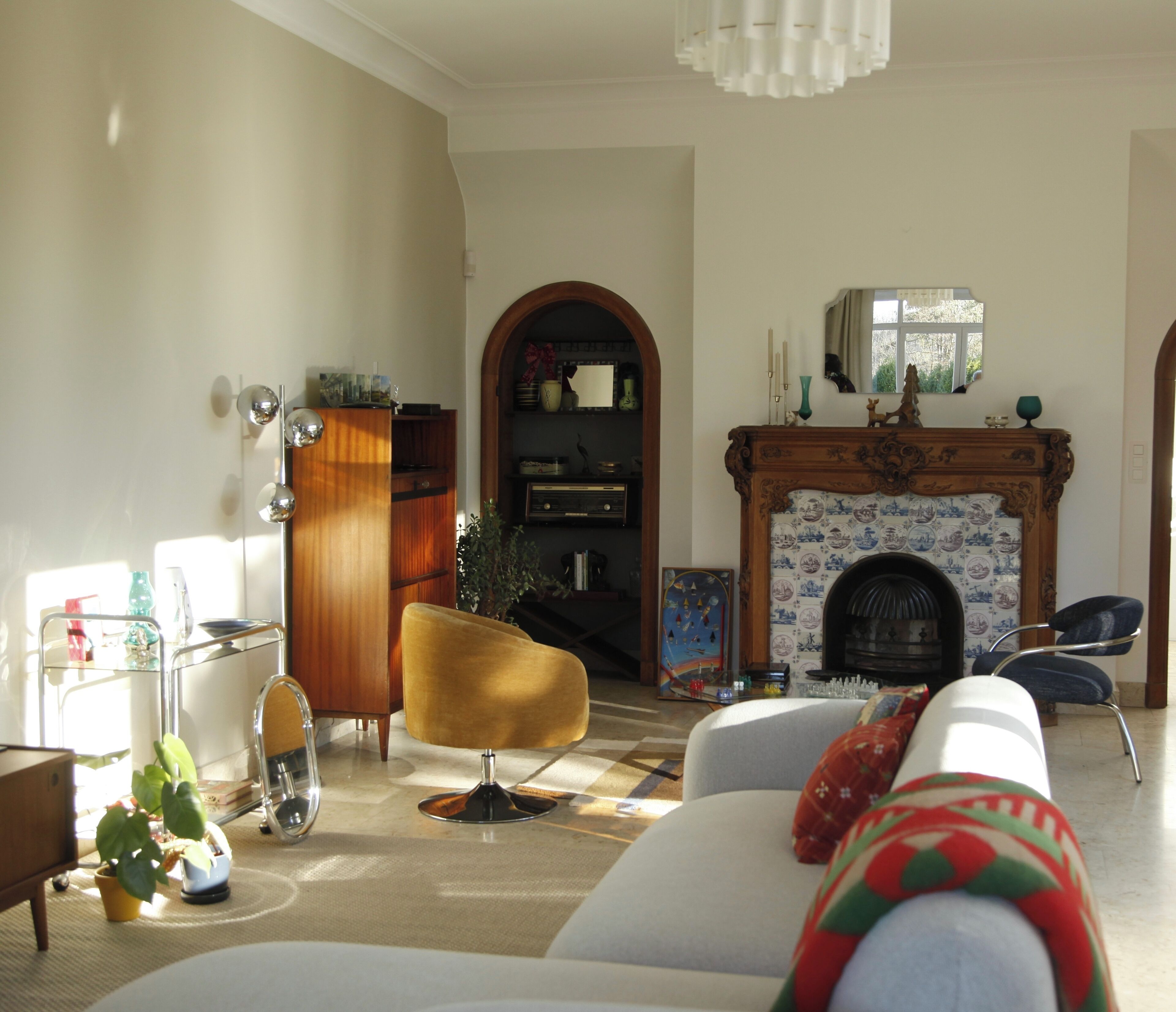A living room with a fireplace, a sofa, a chair, and a coffee table.