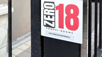 A door with a sign indicating "ZERO 18 POOLROOMS" and a keypad lock.