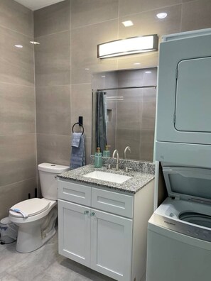 Shower, hair dryer, towels, soap