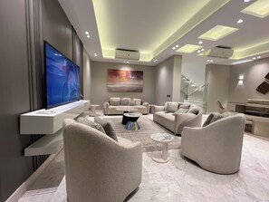 65-inch Smart TV with digital channels - Alsawah 5BR Villa With Private Pool (6th of October City)