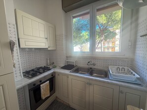 Fridge, microwave, oven, stovetop - Casa Vago - One Bedroom Apartment, Sleeps 6 (Marina di Andora)