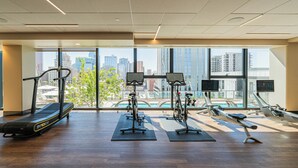 A gym with cardio equipment, a rowing machine, and a stationary bike. - Saiya  804 (Phoenix)