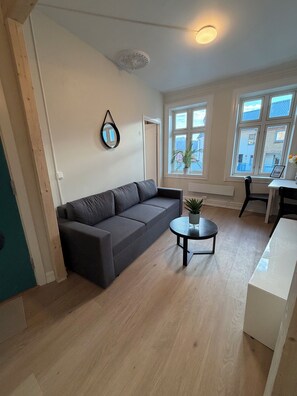 Apartamento, vista para a cidade | Área de estar