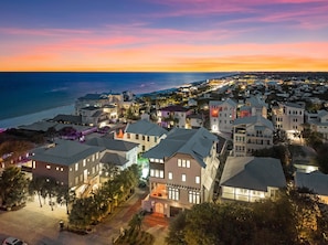 A coastal residential area with houses, a beach, and a sunset. - Seaside Thyme|Private Pool|Steps to Seaside|Golf Cart (Santa Rosa Beach)