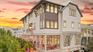 A multi-story house with balconies, large windows, and a pool area. - Seaside Thyme|Private Pool|Steps to Seaside|Golf Cart (Santa Rosa Beach)