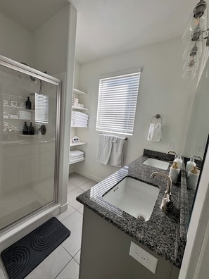 Shower, hair dryer, towels, soap