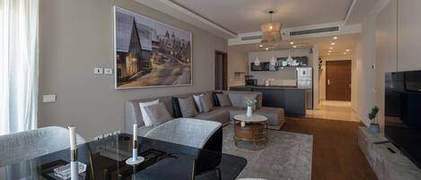 Comfort Apartment, 2 Bedrooms, City View, Executive Level | Living area | 65-inch Smart TV with digital channels