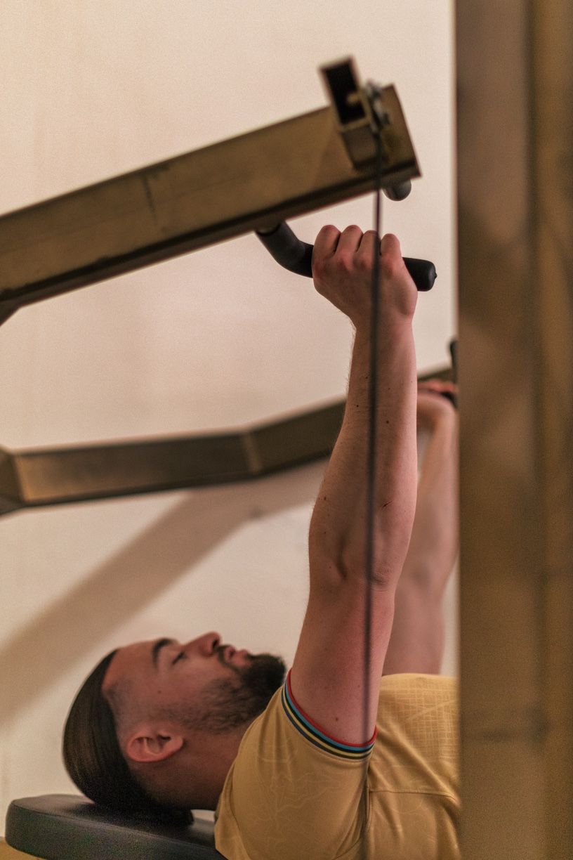 A person using a rowing machine.