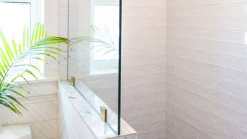 Shower, towels, soap, toilet paper