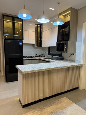 Premium Suite, Park View, Garden Area | Private kitchen - Alsawah Nordic Suite In Village West (Sheikh Zayed City)