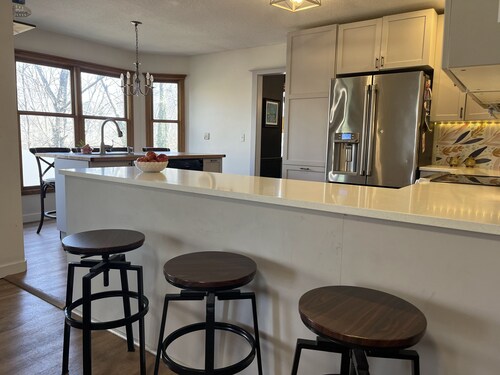 4-bedroom, sleeps 12 with walking trail and easy highway access.