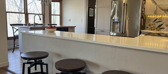 4-bedroom, sleeps 12 with walking trail and easy highway access.