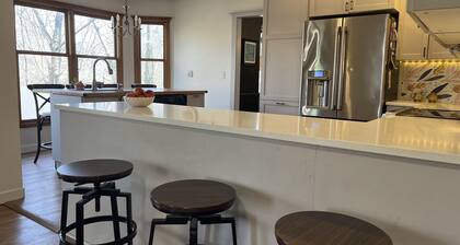 4-bedroom, sleeps 12 with walking trail and easy highway access.