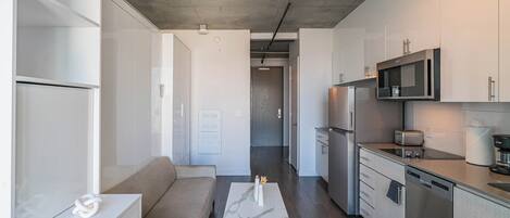 Apartment | Living area | 65-inch Smart TV with cable channels