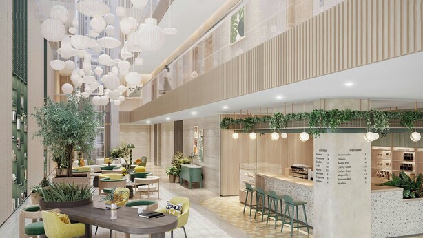 Ein modernes Interieur mit einer zentralen Essecke, einer Bar und einer Speisekarte mit Kaffee und Dessertangeboten.