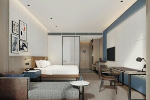 Duntäcken, minibar, värdeförvaringsskåp på rummet och skrivbord