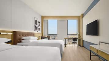 Cubrecamas, minibar, caja de seguridad en la habitación y escritorio