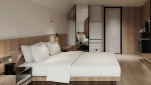 A modern bedroom with a bed, bedside tables, a sofa, and a TV. - Fairfield By Marriott Hengdian (Jinhua)