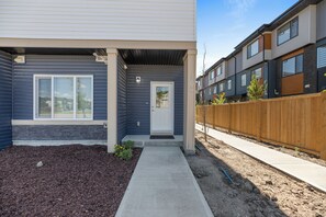 Exterior detail - Brand New 2025 Modern Townhome Near YYC Airport | Garage Parking (Calgary)